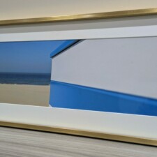 Panoramafoto ingelijst met gouden lijst en ontspiegeld glas